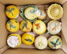Collection of preserve pots and lemon squeezers, mainly in the form of fruits, including a Wilkinson