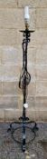 Black-painted scrolling wrought iron standard lamp