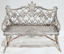 Cast metal bench in the Victorian style, the back with a lattice structure having vine and grape