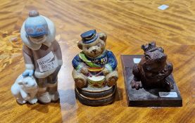 Lladro Eskimo Boy with a polar bear cub , model 5238, together with two cast metal novelty doorstops