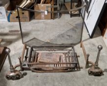 Cast iron firegrate, together with a pair of cast