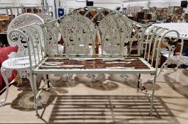 Metal garden bench with green finish, domed back and scrolling arms, 94cm high x 128cm long