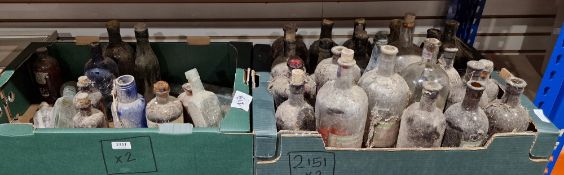 Collection of old bottles, some with partial contents, including A. Saalfeld & Co. of Manchester