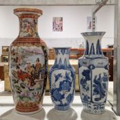 Three modern Chinese ceramic baluster vases, two with blue and white decoration, the other decorated