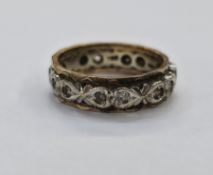 9ct yellow and white gold eternity ring with engraved faceted decoration, set with small mixed cut