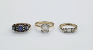 9ct gold and white stone dress ring, set three claw set stones size 'N and a half', gold coloured