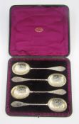 Set of four Victorian silver-gilt fruit serving spoons, Sheffield 1862, makers James Deakin &