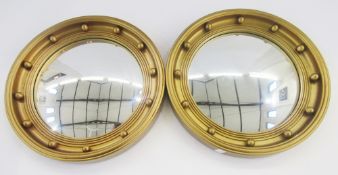 Pair Regency style convex wall mirrors, each circular with ball decorations, 40cms dia. overall (2)