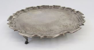 George V silver salver, circular with Chippendale border, on three scroll and pad feet, 35cm