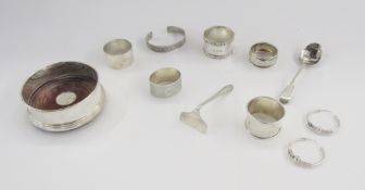 Five silver napkin rings, 20th century, a silver and mahogany mounted wine coaster, hallmarked