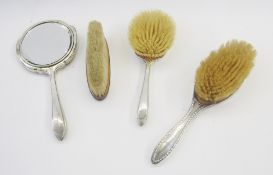 Silver dressing table items, viz: hand mirror and hair brush with engine turned decoration,