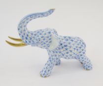 Herend elephant, blue fishnet pattern, 24ct gold accents on the tusks, 9cm highest point of the