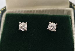 Pair of 18ct white gold and diamond stud earrings, each earring with a round brilliant cut diamond