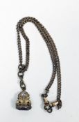 Victorian yellow metal curb link fob chain with fob, the fob with pierced shoulders and set with a
