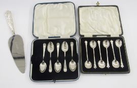 Two cased sets of silver spoons and a cake knife, comprising: six cased Art Deco silver teaspoons,
