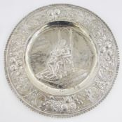 Continental white metal embossed charger marked Sterling, embossed with D Sancho Panza seated on a