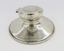 George V silver capstan inkwell, of circular form, weighted base, hallmarked Birmingham 1919, makers