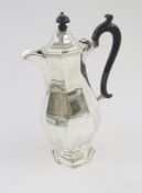 Edwardian silver hot water/chocolate pot, octagonal and panelled with ebonised finial and S-scroll