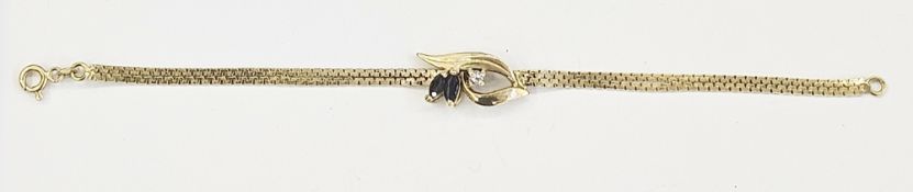 18ct yellow gold, sapphire and white stone bracelet, the two oval cut sapphires on single white