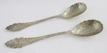 Pair of Eastern white metal serving spoons, with engraved foliate decoration, approximately 5.3ozt