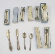 Four silver dog show presentation spoons, a pair of silver preserve spoons, two silver butter