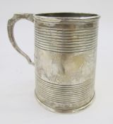 George V silver tankard, London 1927, Goldsmiths & Silversmiths, the tapered body with ringed