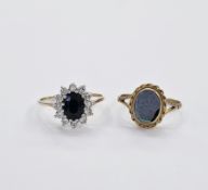 9ct blue and white stone dress ring having oval blue stone surrounded by white stones, size P and