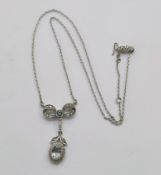 18ct white gold, aquamarine and diamond pendant necklace, the drop pendant collet set with a central