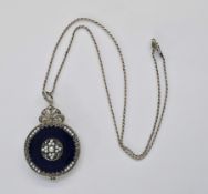 Silver blue enamel, seedpearl and marcasite locket of round form, the back with a clear glass drop