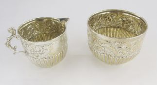 Victorian silver embossed and gadrooned milk-jug and sugar-bowl, hallmarked London, 1887, Goldsmiths