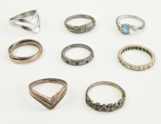 9ct three-coloured gold wishbone ring, 2g approx, a 9ct gold ring set red stone (some missing), four