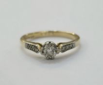 18ct yellow gold and platinum solitaire diamond ring, the claw set round mix cut diamond of approx