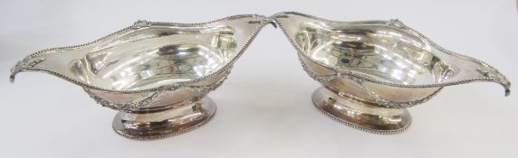 Pair Victorian silver fruit baskets, each oval with everted gadrooned and foliate rim, ribbon and