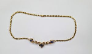 18ct yellow gold, sapphire and diamond necklace comprising three claw set oval mixed cut blue