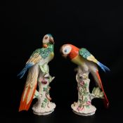 A pair of 20th century hand painted Meissen style porcelain parrot figures with maker's marks to the