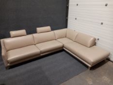 A beige leather and textile corner sofa by Roche Bobois, on short tapered supports. L.313cm