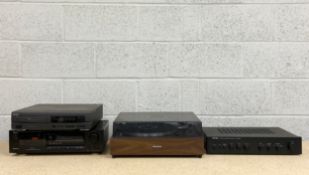 A collection of vintage electrical audio/visual equipment to include a Pioneer turntable, a Rotel
