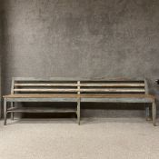 A 19th century painted and distressed French provincial hall bench in pale blue and white having a