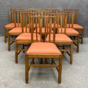 A set of ten Arts and Crafts Cotswold School oak dining chairs in the manner Edward Barnsley, each