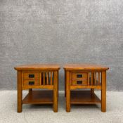 A pair of contemporary oak side or bedside tables each having a square moulded top above a small