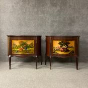 A pair of Louis XV style mahogany cabinets each having a protective glass top above a serpentine