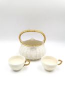 A 19th century Royal Worcester simulated weave basket with a gilt handle, along with two Royal