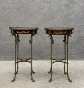 A pair of 20th century French Neoclassical style mahogany side or lamp tables each having a circular