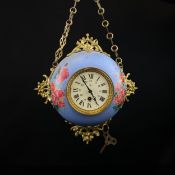 A C.1900 French enamelled circular wall clock with applied gilt metal decoration around the glazed