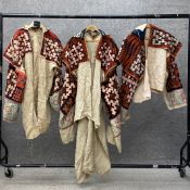 A collection of three possibly 19th century linen and goat's wool jackets traditional to the Miao