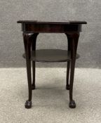 A 19th century mahogany occasional table having a tooled leather octagonal top raised on four
