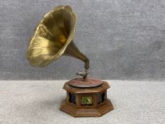 An early 20th century His Majesty's Voice 78rpm gramophone having a large fluted brass horn with a