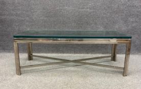 A 1970's vintage chrome framed and plate glass top coffee table. (20mm plate glass). (Chipped as