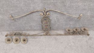 A 19th century wrought iron French ceiling light/candelabra with scrolling foliate decoration. (