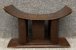 An African Ashanti stool with carved and pierced decoration. 30 x 46 x 26cm